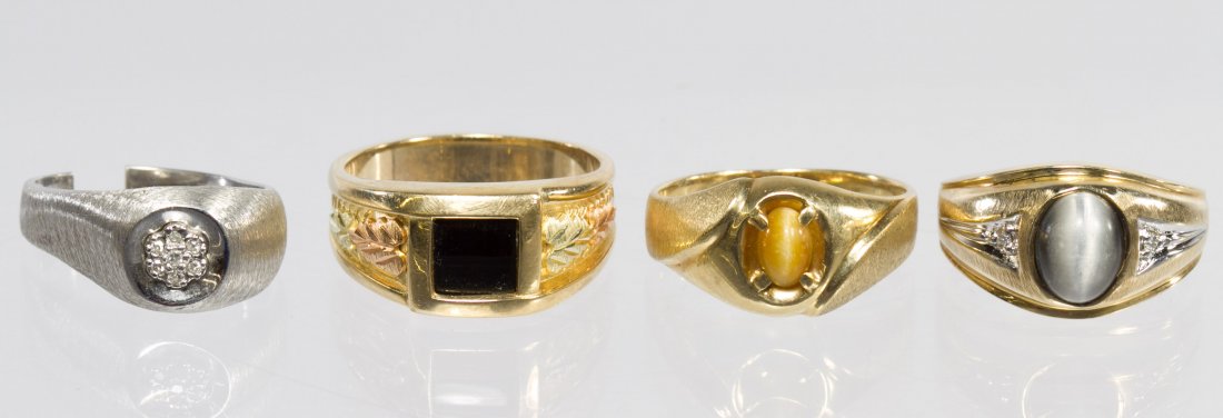 10k Gold and White Gold Rings: 10k Gold and White Gold Rings Four rings; all containing semi-precious stonesSize: 8.5 to 10 Weight: 11.38 dwts. (total weight) Category: Jewelry and Timepieces > 10k Gold Shipping Status: Leonard Auc