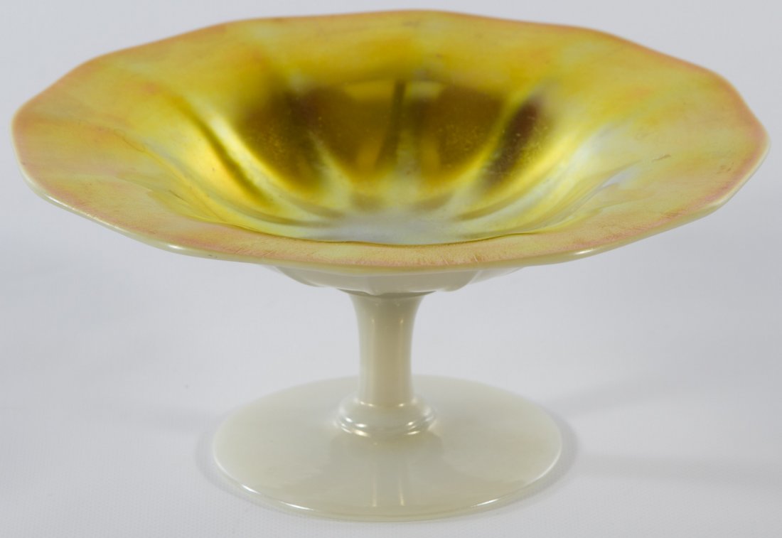 Steuben Calcite Art Glass Ruffled Compote: Steuben Calcite Art Glass Ruffled Compote Iridescent interior with a white exterior Height: 2.75 inches, Width: 6.25 inches Category: Crystal > Steuben Shipping Status: Leonard Auction, Inc. will dire