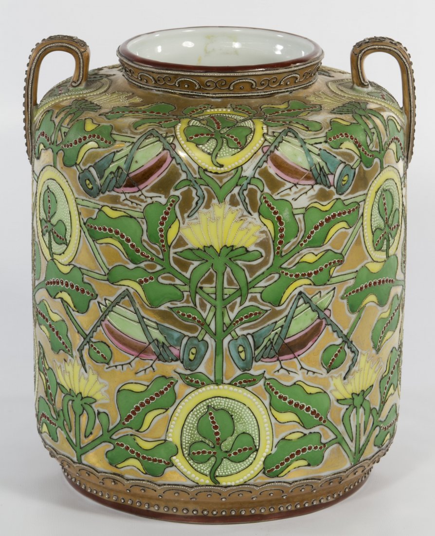 Nippon Porcelain Floral Double Handled Vase: Nippon Porcelain Floral Double Handled Vase Two handled vase having a yellow and green floral motif with grasshopper accents; hand painted green maple leaf Nippon over glaze back stamp Height: 9.00 in