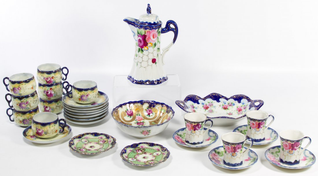Nippon Style Porcelain Tea Set: Nippon Style Porcelain Tea Set Having one set of eight cups and saucers with a painted floral motif; together with a set of four chocolate cups and saucers along with a chocolate pot all of which have