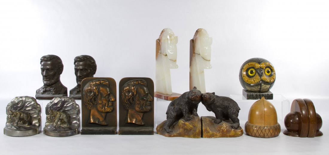 Bookend Assortment: Bookend Assortment Eight sets including two metal Lincoln busts, a metal elephant, a stone horse, a stone owl, two wooden sets and a ceramic bear Height: 10.75 inches (tallest) Category: Books & Ephem