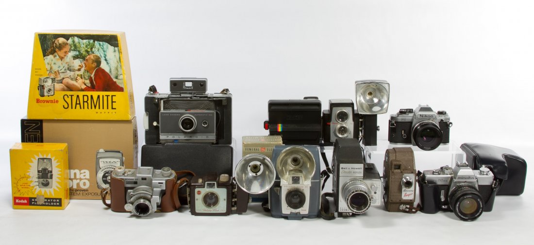 Nikon FG 50mm Camera: Nikon FG 50mm Camera Together with an assortment of cameras from Kodak, Revere, Minolta, Polaroid and Bell & Howell Width: 6.00 inches (Nikon FG) Category: Cameras and Electronics > Cameras Shipping S