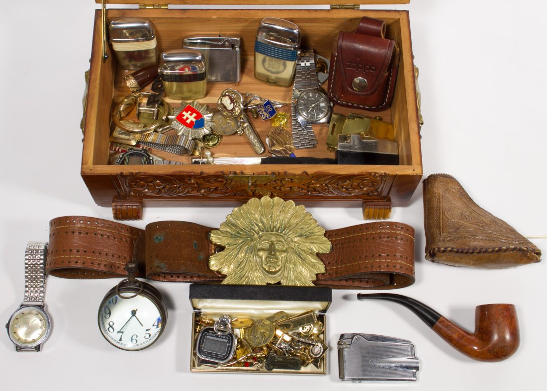 Men's Jewelry and Accessory Assortment: Men's Jewelry and Accessory Assortment Including watches, tie bars, cufflinks, buttons, ribbons, pins, a pipe in leather pouch, belt buckles and lighters in a wood carved box Length: 10.50 inches (box