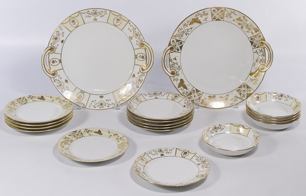 Nippon Porcelain Dish Assortment: Nippon Porcelain Dish Assortment Eighteen items in white, pale yellow and gold colors including two round handled serving dishes, five fruit bowls and eleven dessert plates with five fruit plates havi