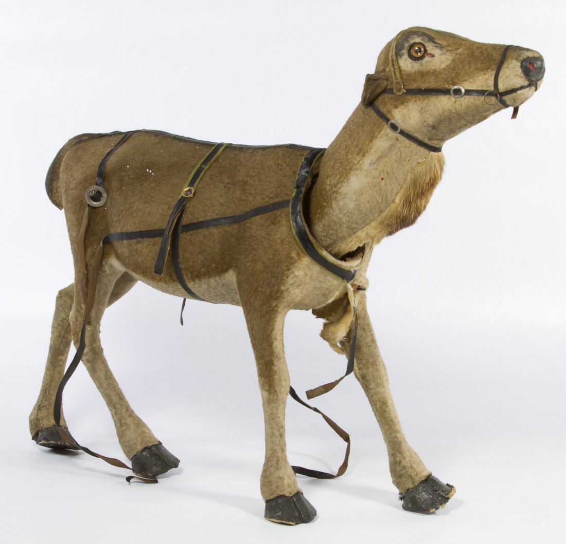 German Plush Reindeer Nodder: German Plush Reindeer Nodder Having a weighted head, fur over papier mache body and leather style straps Height: 16.00 inches, Width: 23.00 inches Category: Toys and Dolls > Antique Dolls Shipping Sta
