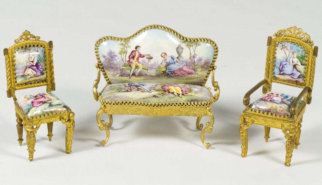 Austrian Enamel Dollhouse Furniture Assortment: Austrian Enamel Dollhouse Furniture Assortment Including a settee, arm chair and side chair with hand painted porcelain imagery and gilt cherubs on the front chair legs; the settee marked 'AUSTRIA' on