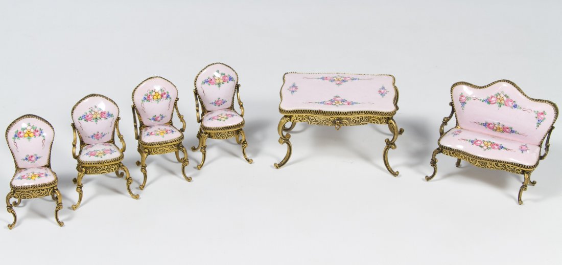 Gilt Metal and Enamel Dollhouse Furniture Assortment: Gilt Metal and Enamel Dollhouse Furniture Assortment Six items including a settee, a center table with pull out drawer, three arm chairs and side chair; all having hand painted flowers on a pink groun