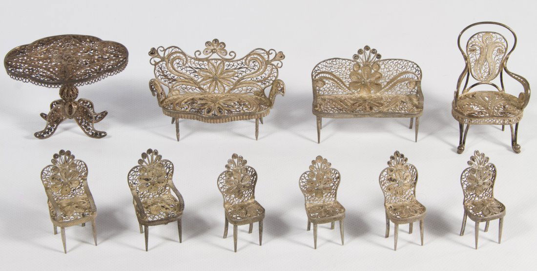 Silver Filigree Dollhouse Furniture Assortment: Silver Filigree Dollhouse Furniture Assortment c.1890, ten items including four side chairs, three armchairs, two settees and a pedestal table Height: 1.50 inches Category: Toys and Dolls > Pre-War To