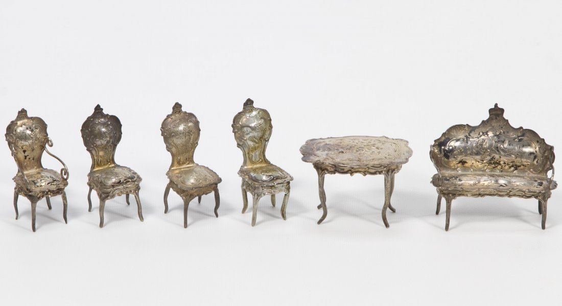 Sterling Silver (.800) Dollhouse Furniture Assortment: Sterling Silver (.800) Dollhouse Furniture Assortment c.1890, six repousse items marked '800' including three side chairs, an armchair, a settee and a table Height: 2.25 inches (settee) Category: Toys