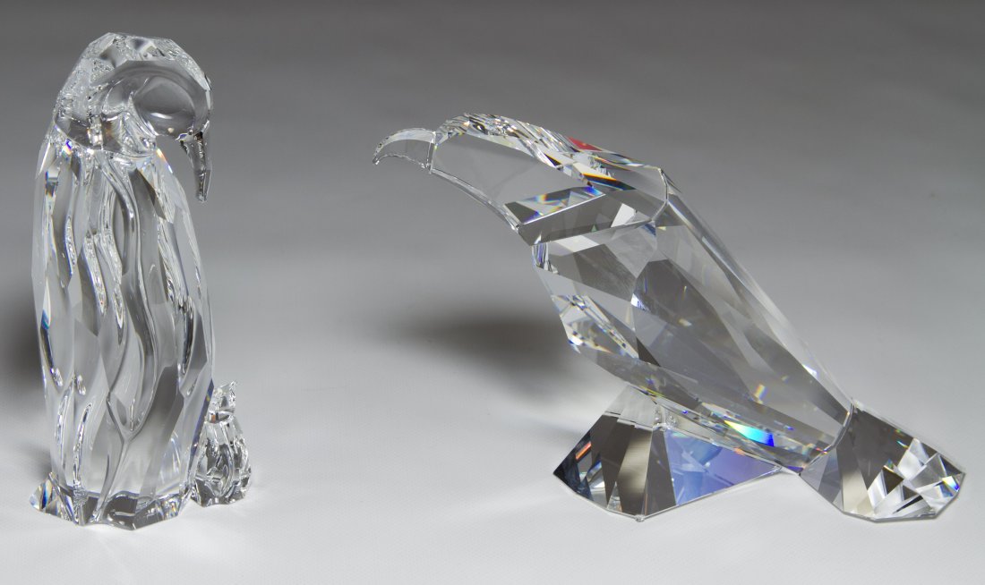 Swarovski Crystal 'Penguin Mother and Baby' and 'Eagle': Swarovski Crystal 'Penguin Mother and Baby' and 'Eagle' Figurines Two items including the penguin #438748 and the eagle #S624599; both with the original boxes Height: 5.00 inches (tallest) Category: C