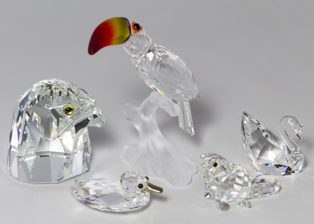 Swarovski Crystal Bird Figurines: Swarovski Crystal Bird Figurines Five pieces including a swan, an eagle head paperweight, a toucan with red beak, a duck and a beaver (in a toucan box) Height: 3.50 inches (toucan) Category: Crystal >