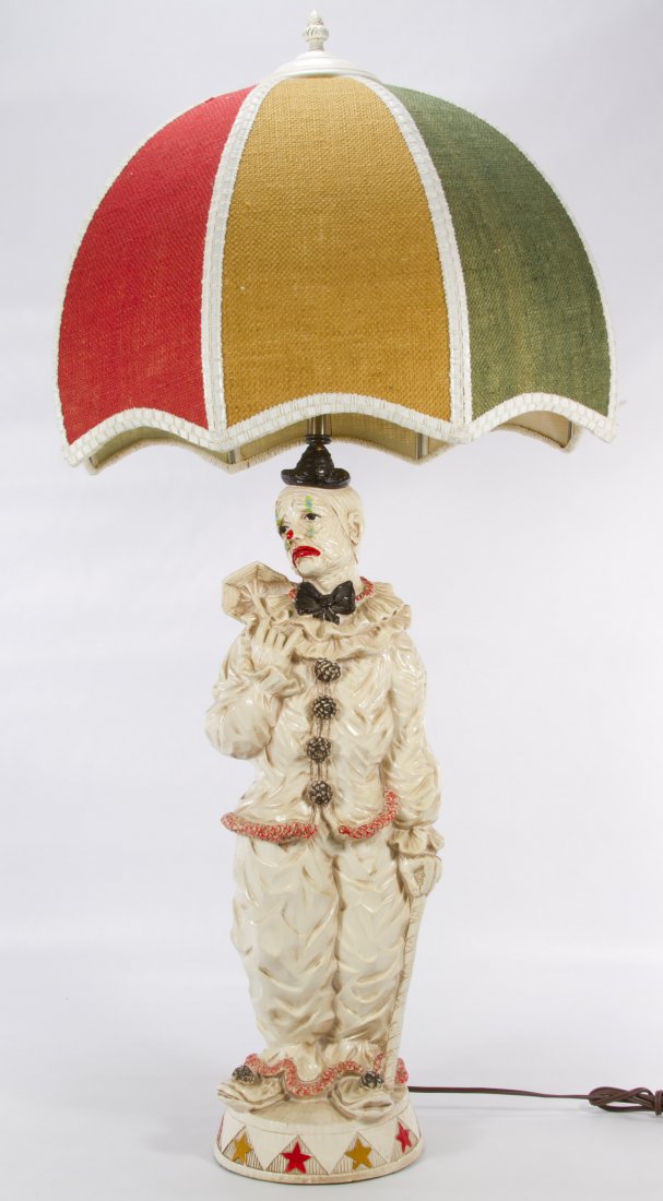 Plaster Clown Lamp: Plaster Clown Lamp 20th Century, having a red, yellow and green lampshade Height: 38.00 inches (includes shade) Category: Decorative Arts > Lamps Shipping Status: 3rd Party Shipping; the shipping cost