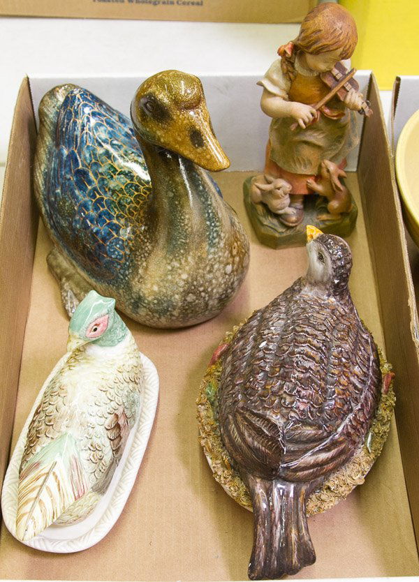 Ceramic Figurine Assortment: Ceramic Figurine Assortment Four items including a Chinese Duck, Italian covered dish, Fitz and Floyd butter dish and wooden female figurine Height: 9.00 inches (tallest) Category: Porcelain and Ceram