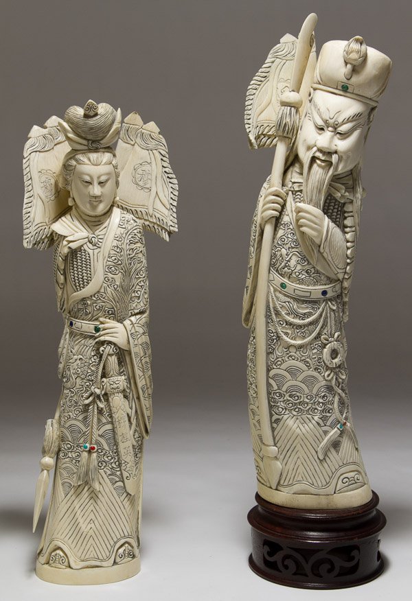 Asian Carved Ivory Figurines: Asian Carved Ivory Figurines 20th Century, depicting a male and female holding weapons; both are marked on the backside; **Ships to United States address only** Height: 14.50 inches (tallest with stan