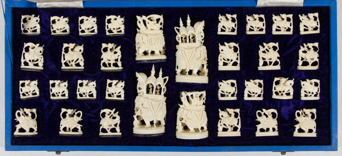 Carved Ivory and Bone Chess Set: Carved Ivory and Bone Chess Set 20th Century, having twenty-eight small ivory pieces and four large carved bone pieces **Ships to United States Addresses Only** Height: 3.75 inches (tallest) Category:
