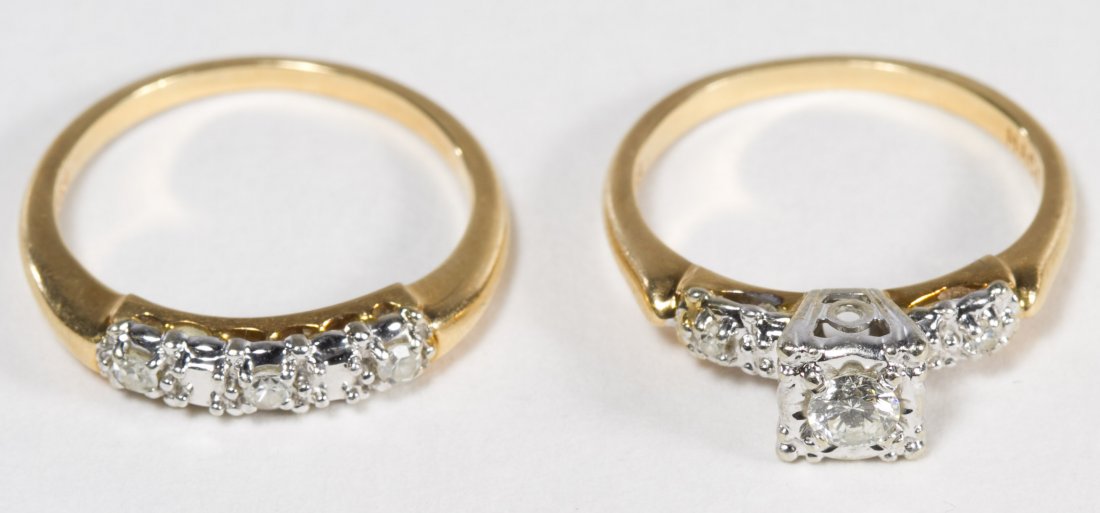 14k Gold Wedding Ring Set: 14k Gold Wedding Ring Set Engagement and wedding band, both set with diamonds; engagement having a central stone approximately 0.20CT and two side stones approximately 0.04CTtw; wedding band having th