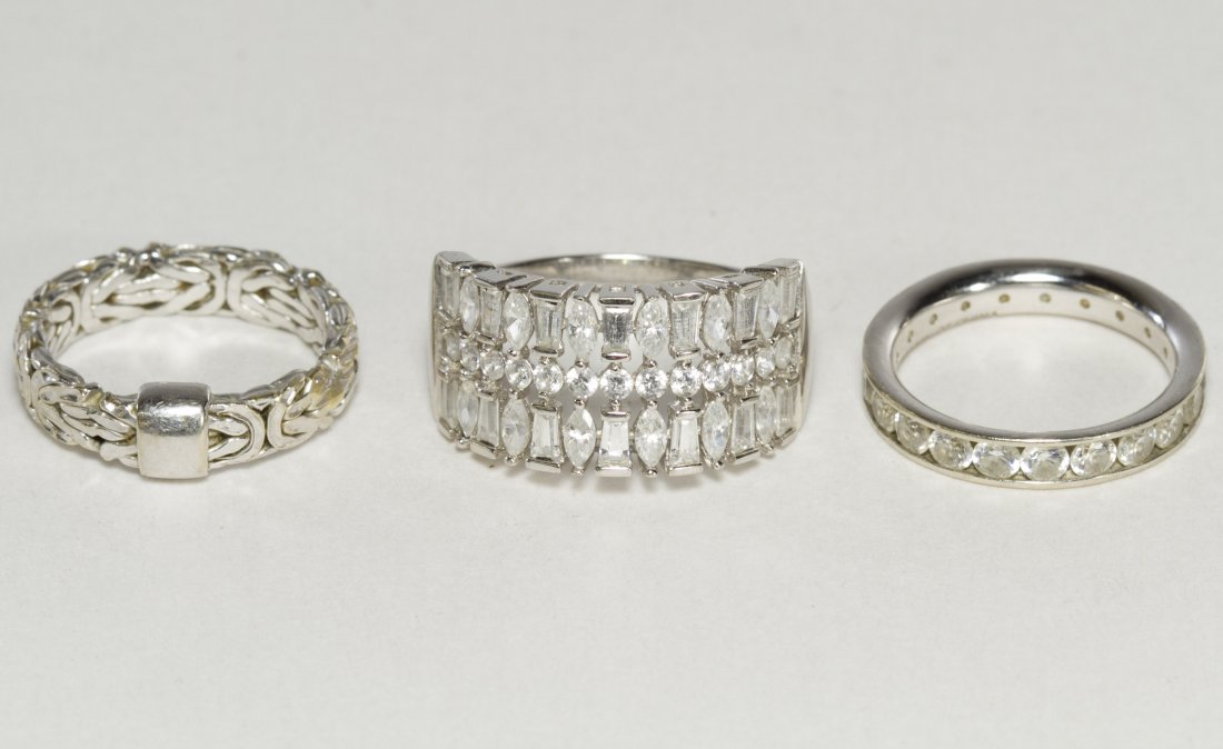 14k White Gold and CZ Rings: 14k White Gold and CZ Rings Three rings, two having cubic zirconia, the other having a Byzantine design Weight: 6.69 dwts. (total weight) Category: Jewelry and Timepieces > 14k Gold Shipping Status: L