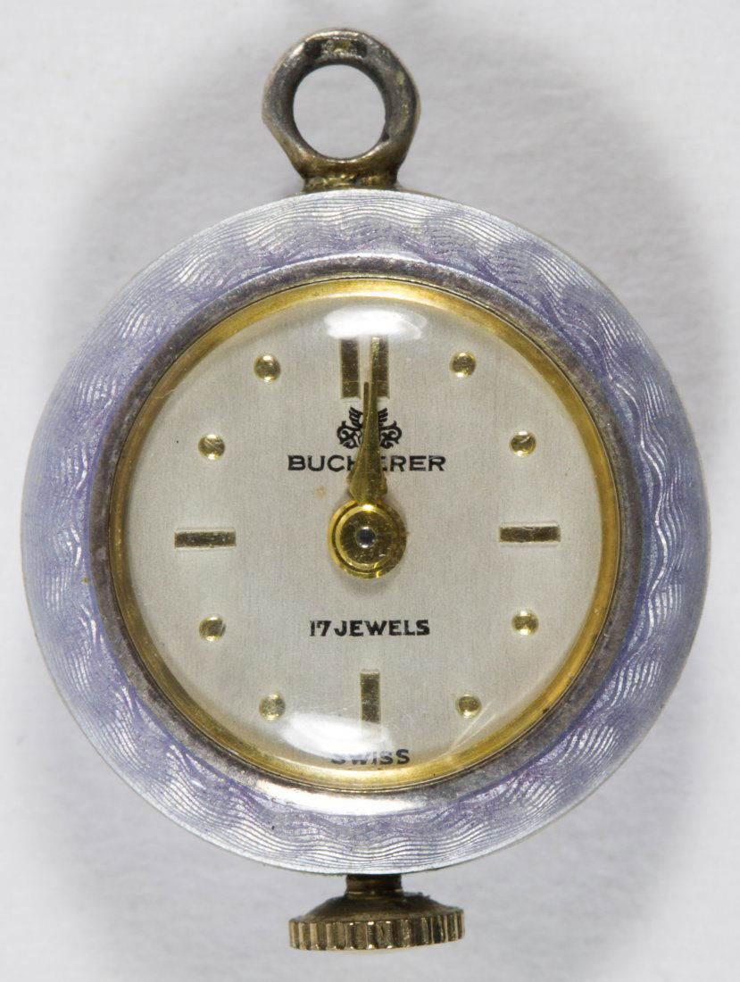 Enameled Sterling Silver Bucherer Watch: Enameled Sterling Silver Bucherer Watch Enamel over a machine turned base Width: 0.75 inches Weight: 5.66 dwts. (total weight) Category: Jewelry and Timepieces > Women's Pocket Watches Shipping Status