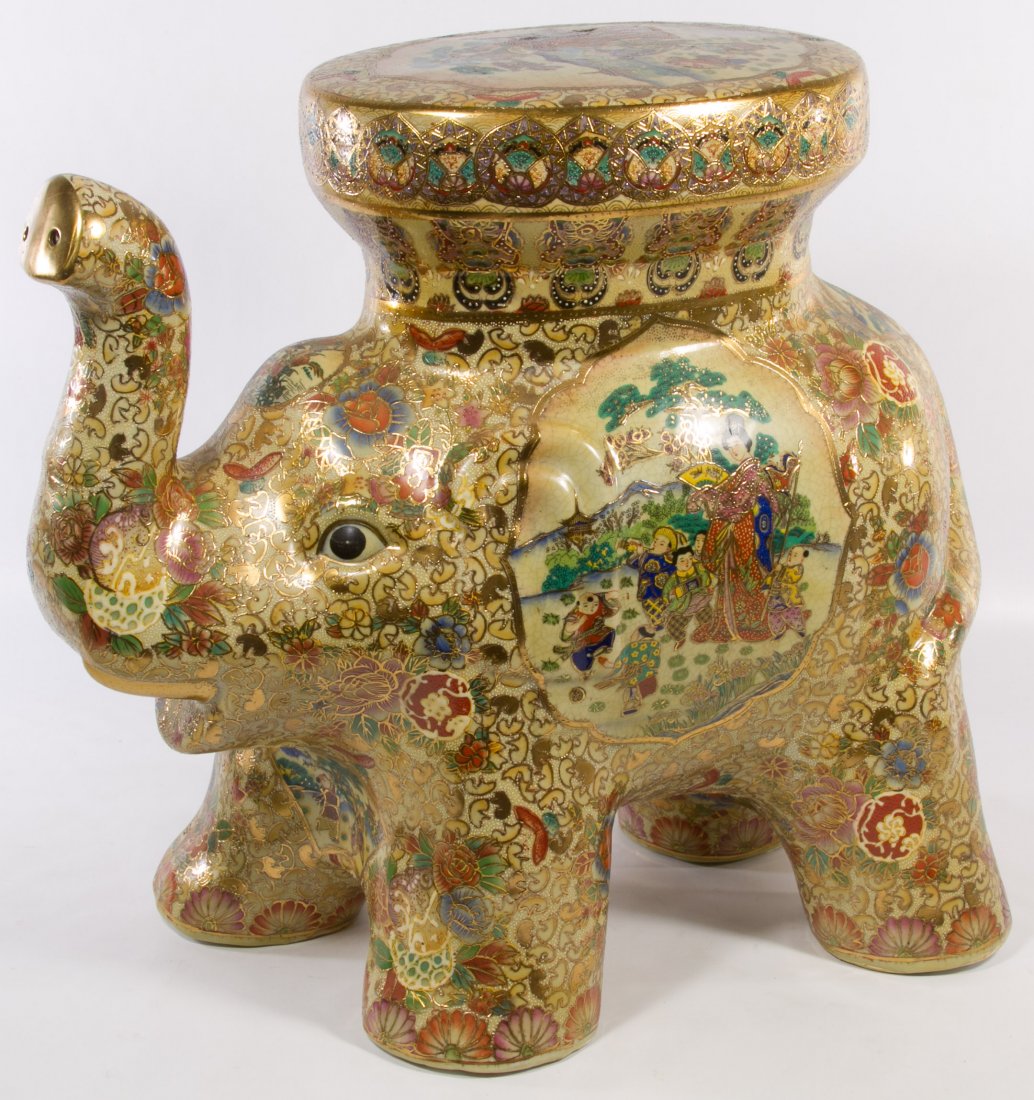 Asian Ceramic Elephant Stand: Asian Ceramic Elephant Stand Having Satsuma style moriage decoration with a Geisha figure in center panel on each side; unmarked Height: 18.50 inches, Width: 20.00 inches Category: Decorative Arts > A