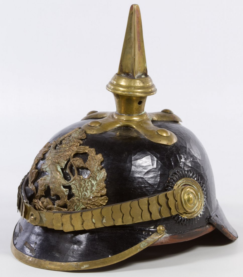 World War I German Pickelhaube Helmet: World War I German Pickelhaube Helmet Having a standing lion with sword emblem from a Hesse Officer Height: 10.00 inches, Length: 9.00 inches Category: Military & Weapons > World War I Shipping Status