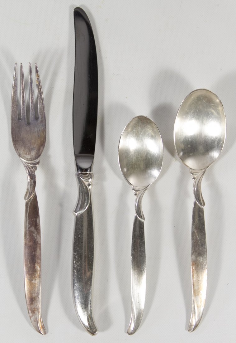 Rogers Bros. 'Flair' Silverplate Service Set: Rogers Bros. 'Flair' Silverplate Service Set Including (12) dinner knives, (10) dinner forks, (8) teaspoons, (12) soup spoons, (2) slotted serving spoons, (2) serving spoons, a butter knife, a sugar s
