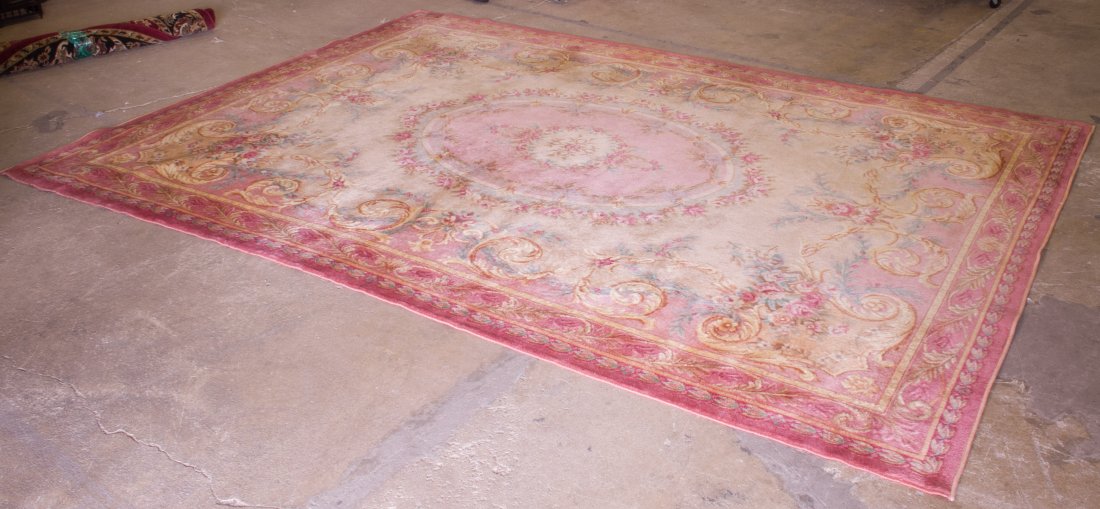 Aubusson Style Silk Area Rug: Aubusson Style Silk Area Rug Having a mauve border with center oval medallion Length: 143.00 inches, Width: 104.50 inches Category: Rugs and Textiles > Other Shipping Status: 3rd Party Shipping; the s