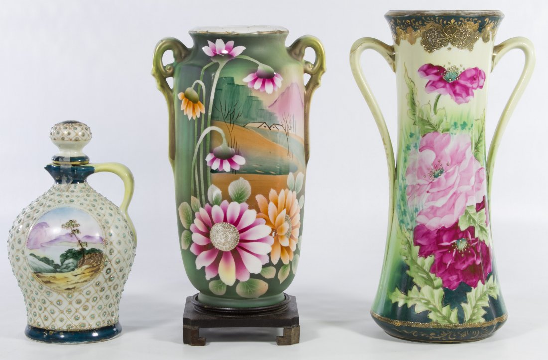 Nippon Vase Assortment: Nippon Vase Assortment Three items including a two handled vase marked 'Made in Japan,' a 'Royal Nippon' marked vase and a Nippon blue maple leaf marked decanter with moriage decoration Height: 14.00 