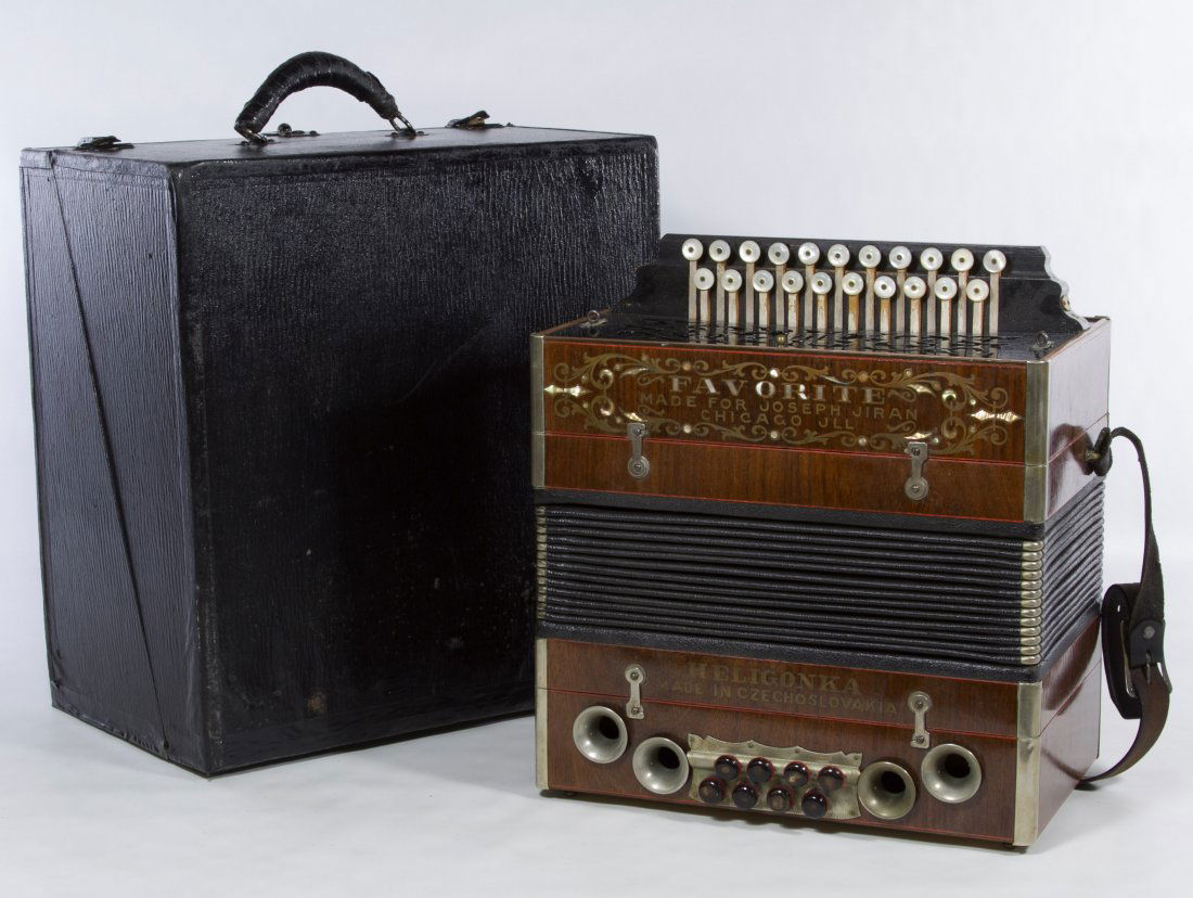 Czech 'Favorite' Concertina by Heligonka: Czech 'Favorite' Concertina by Heligonka Having a label 'Made for Joseph Jiran,' 29 different buttons and its original case Height: 13.00 inches, Width: 14.00 inches Category: Musical Instruments > Ac