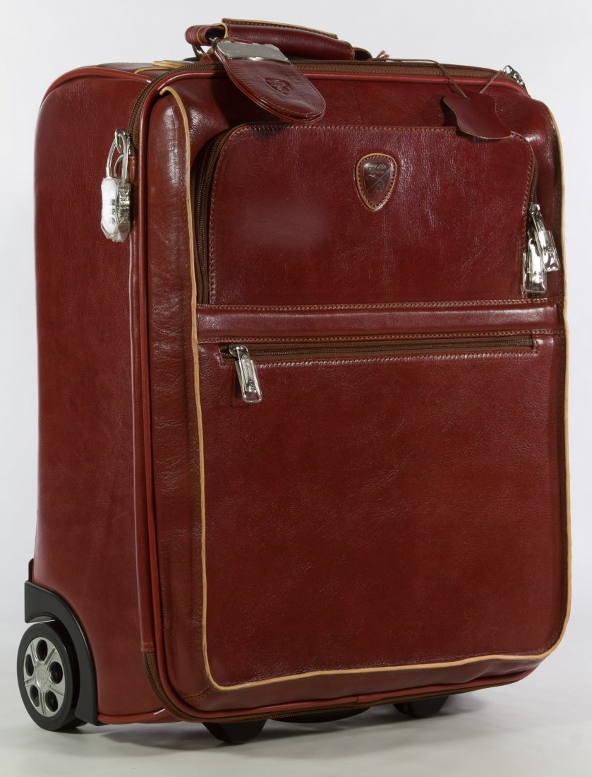 Lamborghini Luggage: Lamborghini Luggage Having a leather body with combination lock, original tags, model number KH4055 and fabric cover Height: 19.00 inches, Width: 14.50 inches, Depth: 8.00 inches Category: Clothing & 