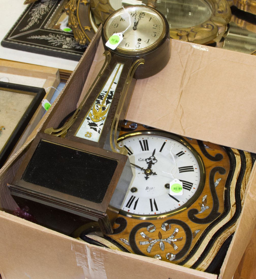 Clock Assortment: Clock Assortment Two clocks including a Genret Dijon having mother of pearl and ebony inlay and a Seth Thomas banjo clock Height: 24.50 inches, Width: 19.50 inches (largest) Category: Decorative Arts