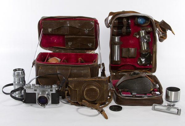 Nikon 35mm Camera Outfit: Nikon 35mm Camera Outfit Serial #6108377 having Nippon Kogaku Nikkor-S 1:1.4 5cm lens; together with a Nikkor-Q 1:3.5 13.5cm lens, cases, filters and a flash attachment Category: Cameras and Electroni