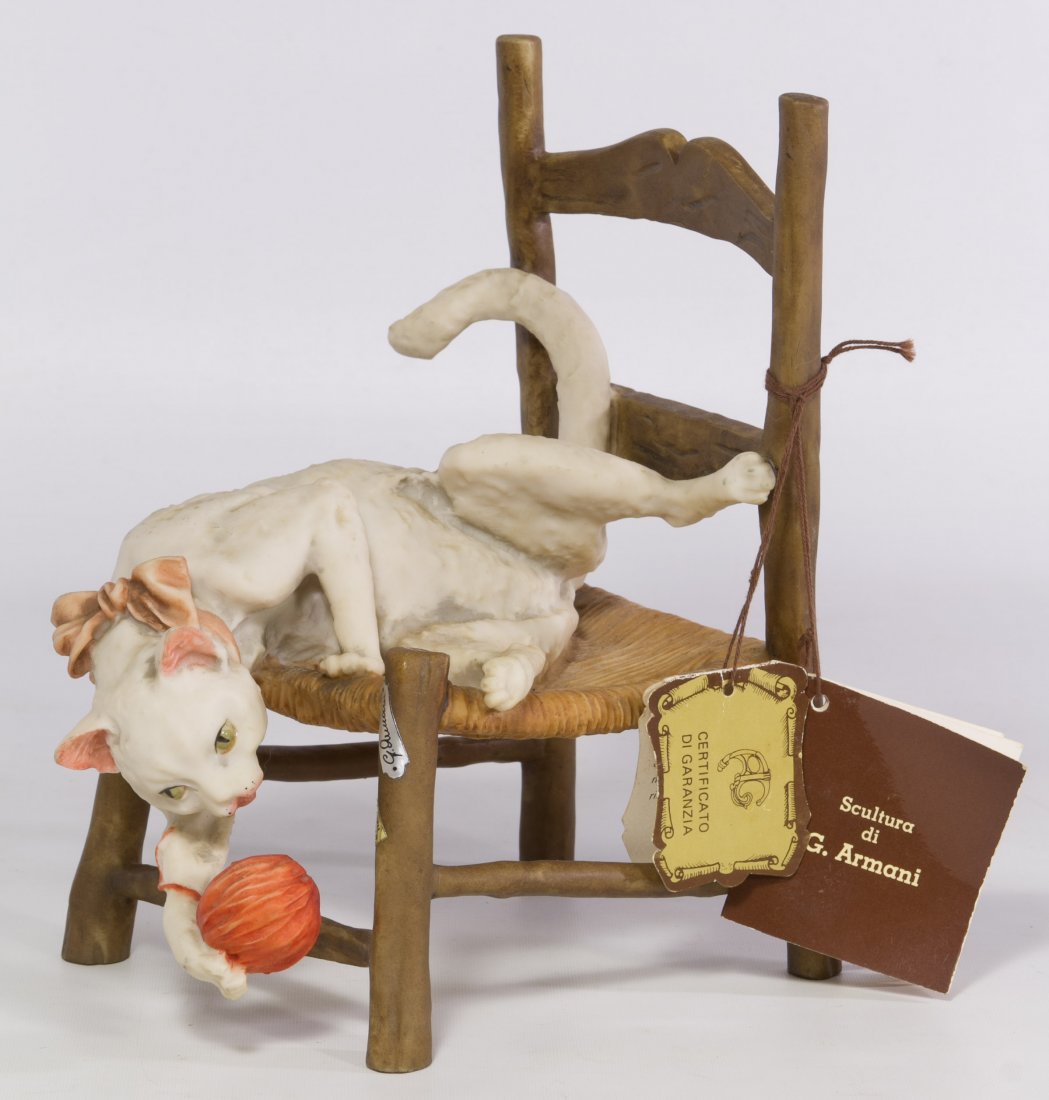 Armani Cat and Chair Figurine: Armani Cat and Chair Figurine Having a figure of a cat grabbing a ball of yarn and sitting on a rush style ladder back chair; along with original decal stickers and booklet Height: 9.00 inches Categor
