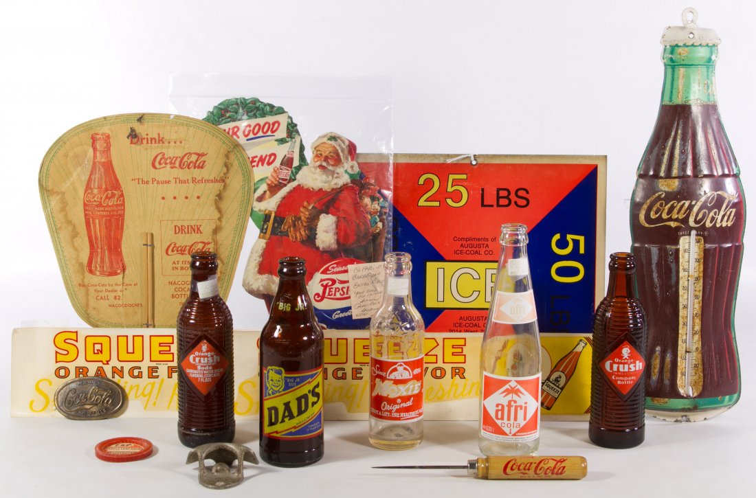 Soda Advertising Assortment: Soda Advertising Assortment Including glass bottles from Moxie, Orange Crush and Dad's root beer, a Coca-Cola tin thermometer and a Santa Claus Pepsi Cola die cut cardboard Christmas display Height: 1