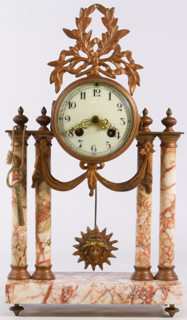 Marble and Gilt Bronze Ormolu Mantle Clock: Marble and Gilt Bronze Ormolu Mantle Clock Having an unmarked porcelain dial, marble pillars and base, pendulum and key Height: 14.50 inches, Width: 8.50 inches Category: Decorative Arts > Clocks Ship