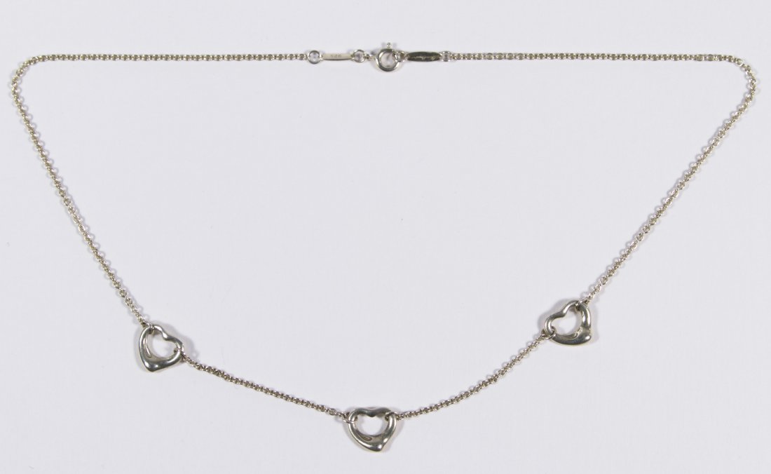 Tiffany & Co Sterling Silver 'Open Heart' Necklace by: Tiffany & Co Sterling Silver 'Open Heart' Necklace by Elsa Peretti Having three integrated hearts Length: 18.00 inches Weight: 2.83 dwts. Category: Jewelry and Timepieces > Sterling Silver Shipping St