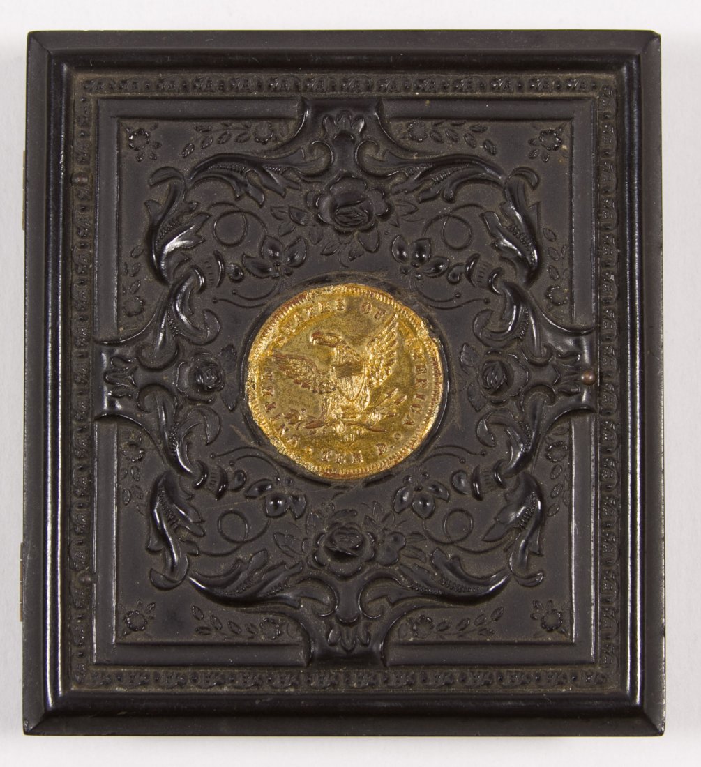 Civil War 1/6 Plate Gutta-Percha Case with $10 Gold: Civil War 1/6 Plate Gutta-Percha Case with $10 Gold Coin Motif Containing an ambrotype photograph of a young woman Height: 4.00 inches, Width: 3.25 inches Category: Books & Ephemera > Photographs Ship