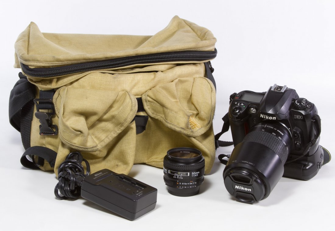 Nikon D100 Camera: Nikon D100 Camera Having a Nikon AF Nikkor 1:4-5.6G 70-300mm lens, an AF Nikkor 1:1.4D 50mm lens, a charger, an electric cord and camera bag Height: 6.50 inches (camera) Category: Cameras and Electron