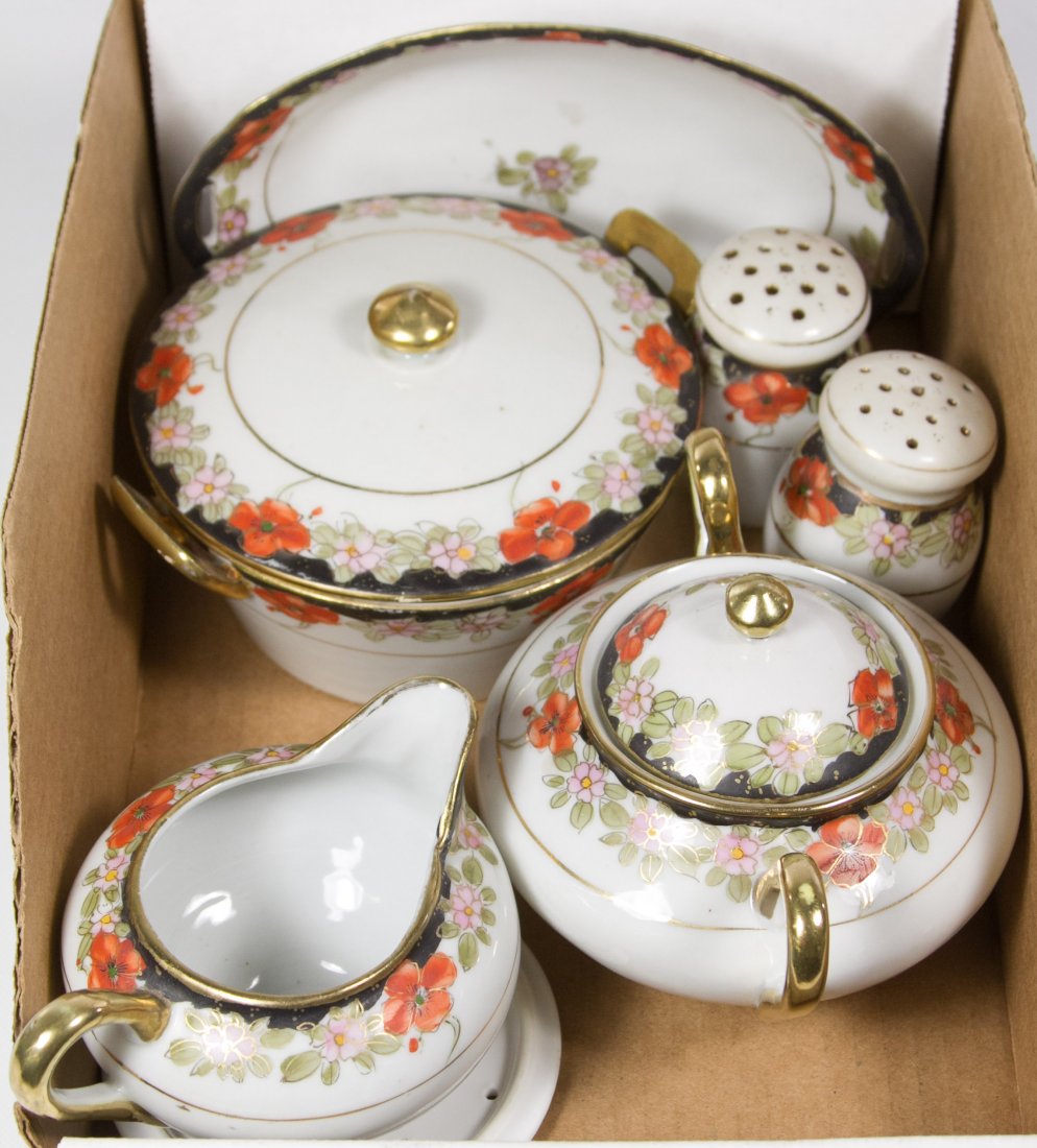 Te-Ho Nippon China Serving Assortment: Te-Ho Nippon China Serving Assortment Having hand painted orange flowers with black rims and including a butter dish with liner, salt and pepper, sugar, creamer and oval serving dish Length: 7.25 inch