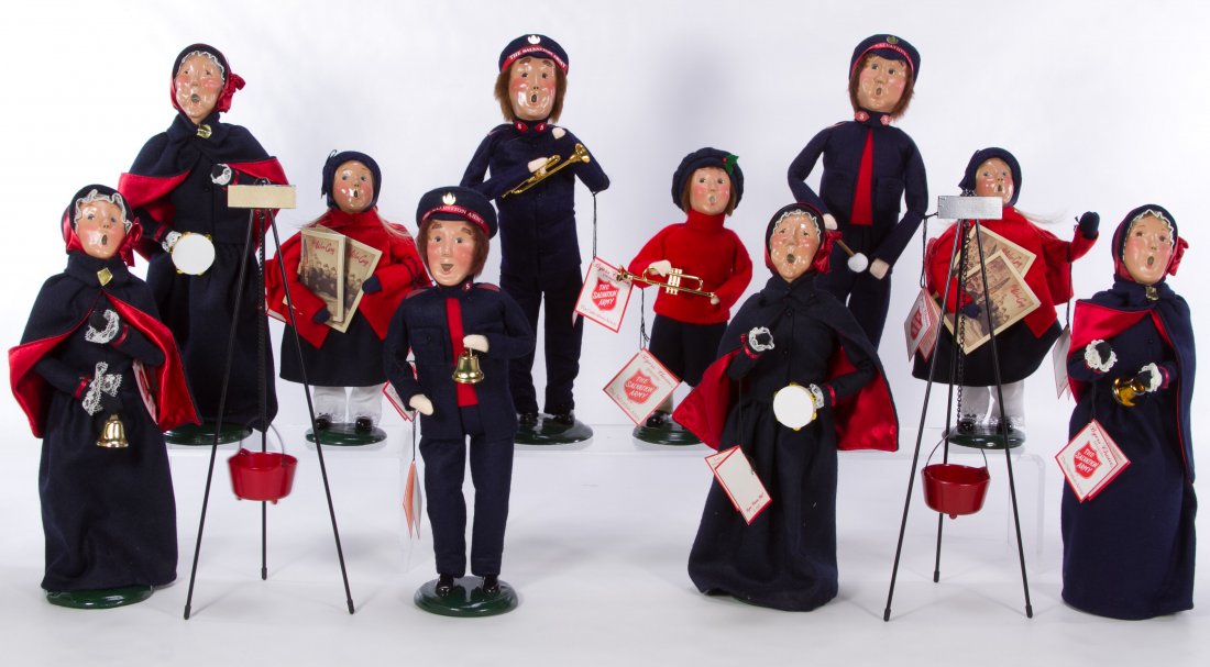 Byers Choice Salvation Army Carolers Assortment: Byers Choice Salvation Army Carolers Assortment Ten figures including musicians, 'The War Cry' newspaper carriers and bell ringers; together with two tripods with red kettles Height: 13.50 inches (tal