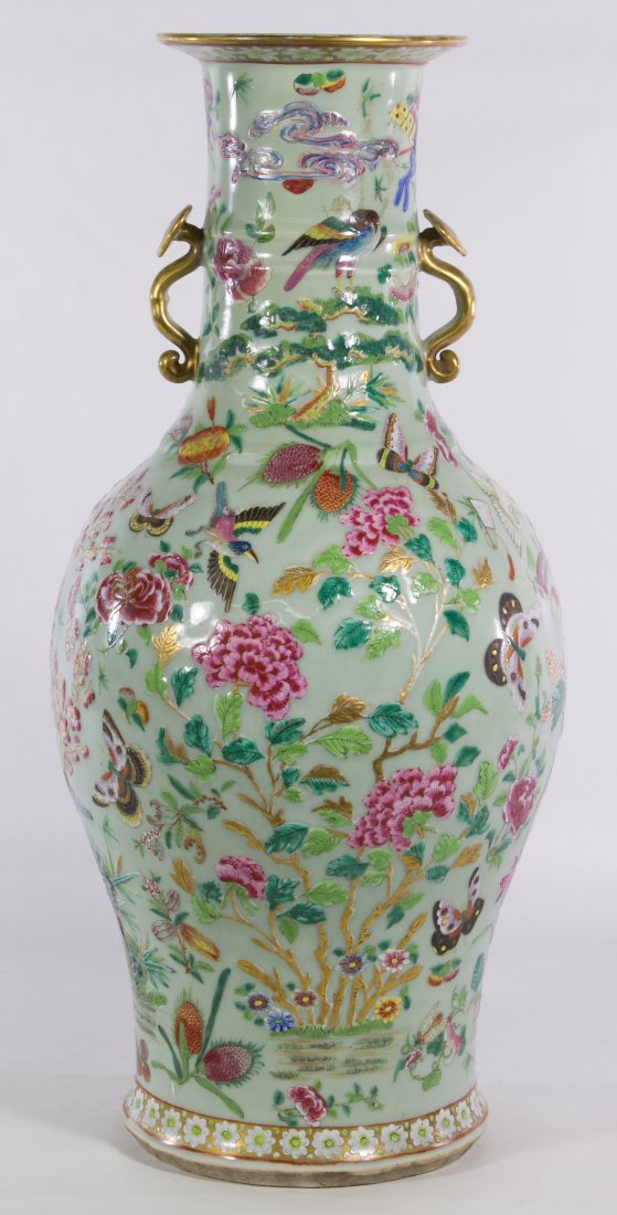 Asian Butterfly Vase: Asian Butterfly Vase Having hand painted and enamel butterflies, birds and flowers on this unmarked vase with gold heart shaped scepter handles Height: 23.25 inches Category: Decorative Arts > Asian S