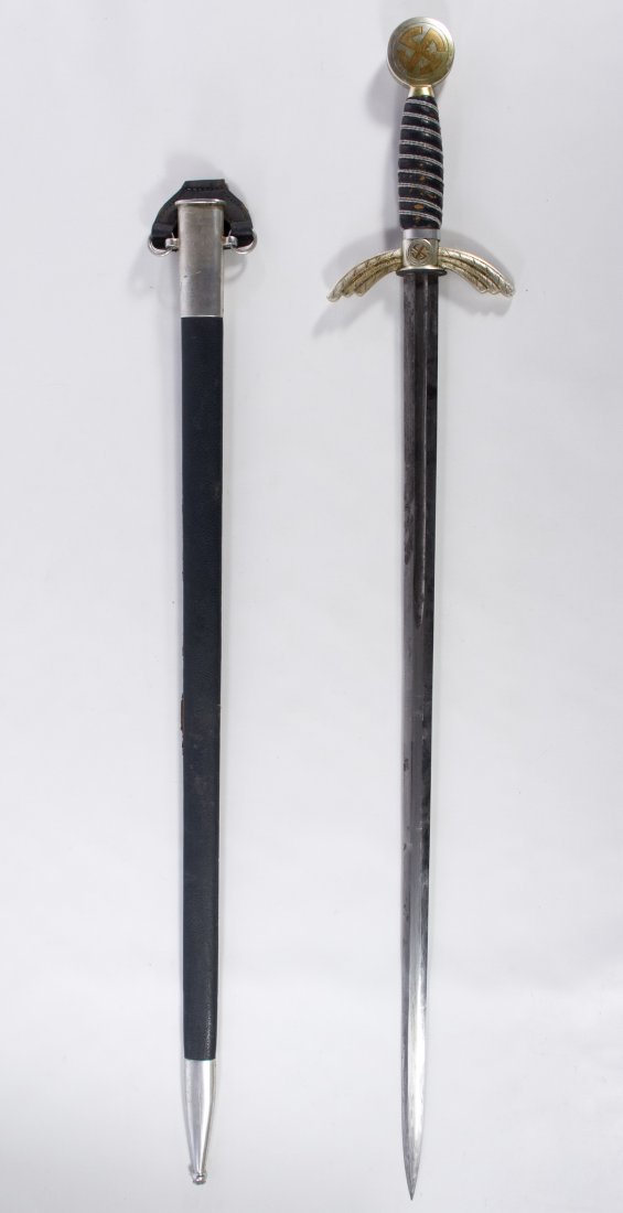 World War II German Nazi Air Force Sword: World War II German Nazi Air Force Sword Having the Eickhorn Soligen mark on the blade, a leather grip and a metal and leather style scabbard Length: 35.00 inches Category: Military & Weapons > World 