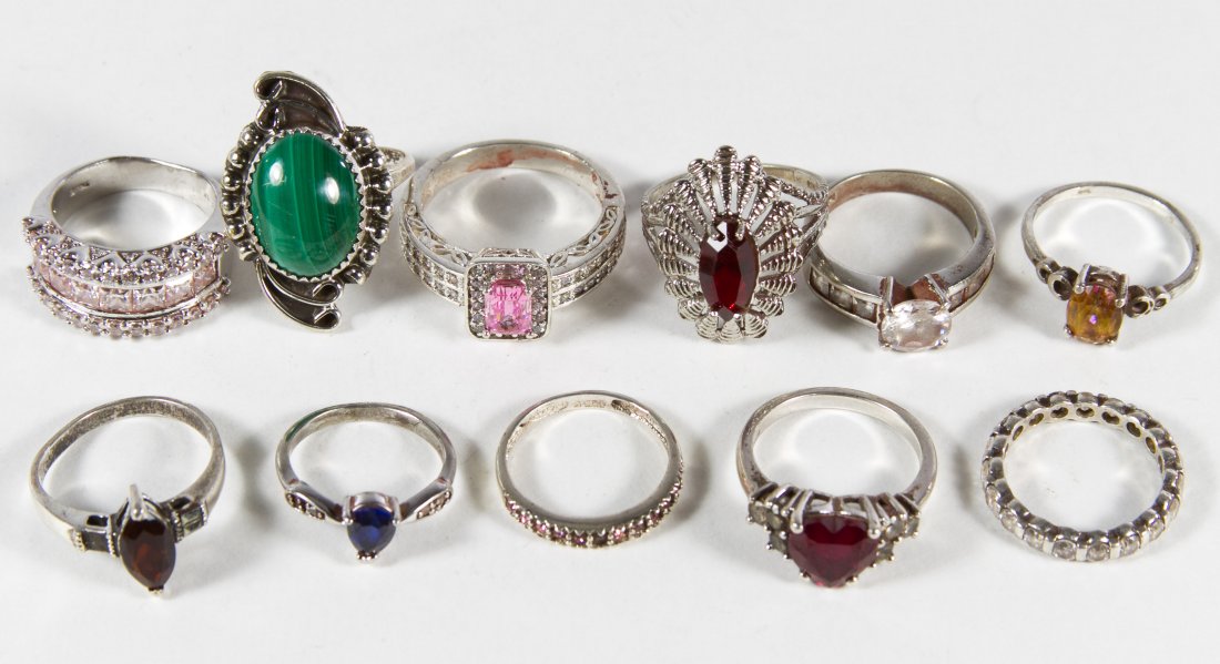 Sterling Silver Ring Assortment: Sterling Silver Ring Assortment Ten rings having semi-precious gemstones and clear and colored crystals; semi-precious gemstones include ruby, sapphire and mystic topaz Size: 4.5 to 10 Weight: 27.39 d