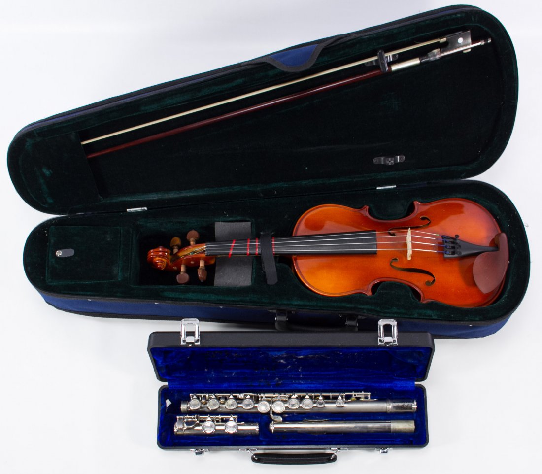 Flute and Violin: Flute and Violin Two instruments with cases including a Rossetti flute #C1011793 and a contemporary violin with 'Guanok' stamped on the bridge Length: 22.50 inches (violin) Category: Musical Instrumen