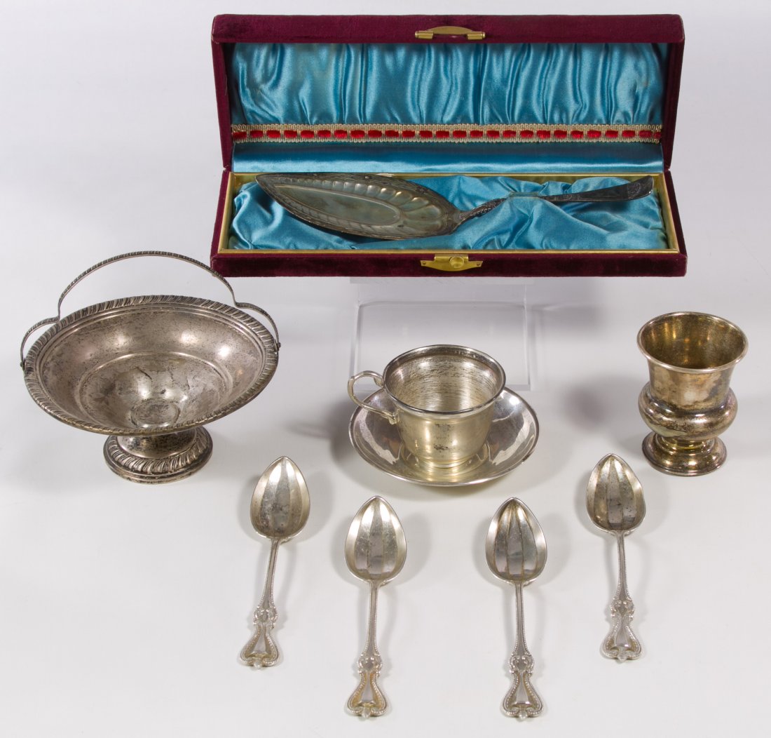 Sterling Silver Object Assortment: Sterling Silver Object Assortment Having six Towle grapefruit spoons, toothpick holder, weighted candy dish, pie server with original red velvet box and a Hecho En Mexico cup and saucer Length: 5.75 i
