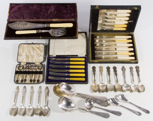 Silverplate Flatware Assortment: Silverplate Flatware Assortment Including (6) knives and (6) forks with bone handles, (6) knives with bakelite handles, (6) demitasse spoons, (7) souvenir spoons, (5) Dionne Quintuplet spoons, (7) Han