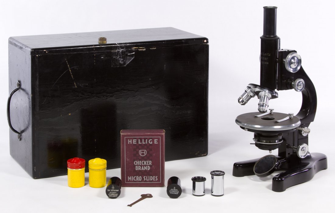 Ernst Leitz Wetzlgar Microscope: Ernst Leitz Wetzlgar Microscope Model #312099 with two attached lenses, a box of Helig slides, the original microscope box, two empty lens containers and two extra lenses Height: 13.25 inches (microsc