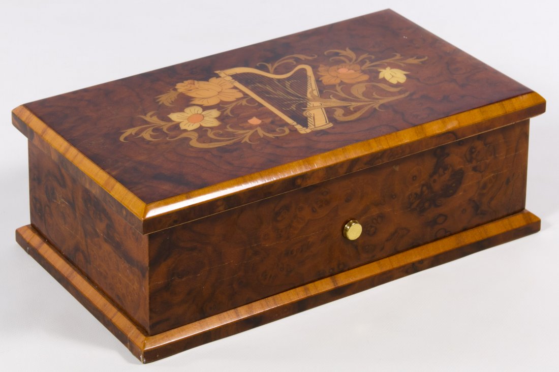 Reuge Music Box: Reuge Music Box Having an Italian marquetry box; plays the Hungarian Rhapsody by Franz List; marked 3/72 on the paper label on underside of lid Height: 3.50 inches, Width: 10.00 inches, Depth: 5.75 in