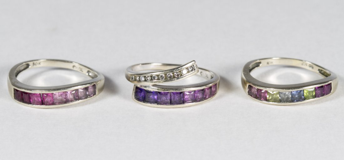10k White Gold, Semi-Precious Gemstone and Diamond: 10k White Gold, Semi-Precious Gemstone and Diamond Stacking Ring Set Three rings having various color semi-precious gemstones, one with a tail set with round cut diamonds Size: 8 Weight: 4.82 dwts. (t