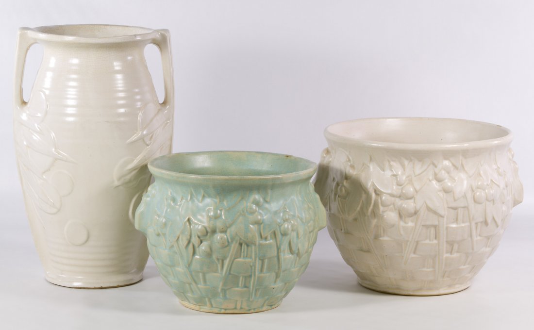 McCoy 'Sand Dollar' Pottery Vase: McCoy 'Sand Dollar' Pottery Vase Stamped 'U.S.A.' mark on the underside; together with one white and one green planter; both planters are unmarked Height: 14.50 inches (vase) Category: Pottery > McCoy