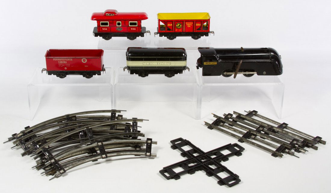 Marx 'Mecury' Key Wind Toy Train Set: Marx 'Mecury' Key Wind Toy Train Set Including the engine, four tin lithgraphed train cars and sections of track; includes engine key Length: 8.50 inches Category: Toys and Dolls > Vintage Trains Ship